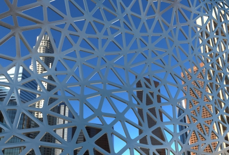 architectural background with metal frame construction and cityscape behinde it