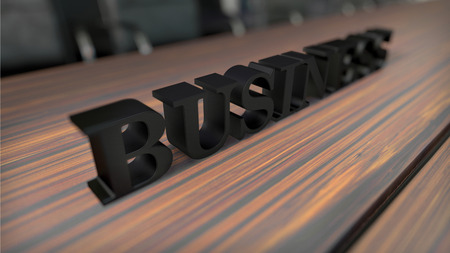 black bold word ''business'' on wooden desk with depth of fieldの写真素材