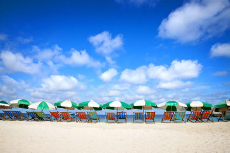 beautiful small beach with sunbeds and umbrellasの写真素材