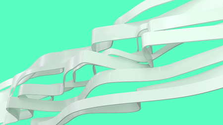 abstarct white shapes made of glossy plastic isolated on greenの写真素材