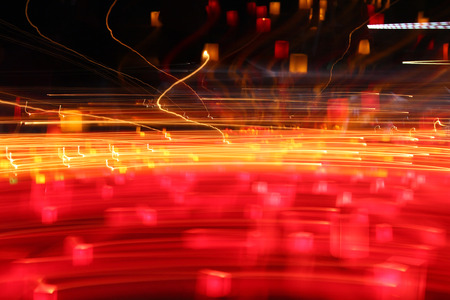 red and yellow abstract blurred lights in dark space