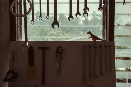 old dusty workshop with instruments and bright window