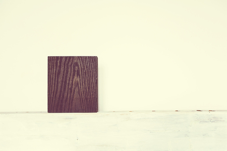 rich textured dark wood block on white backgroundの写真素材