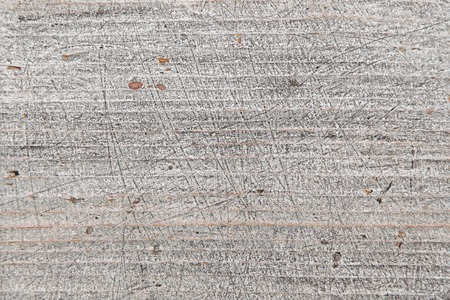 Close up view of old weathered and scratched rough wooden board, wooden background and texture