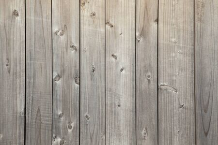 Natural background with unpainted weathered wooden boards