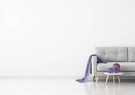 Livingroom interior wall mock up with gray velvet sofa, violet plaid, vases and coffee table on empty white background. 3D rendering.の写真素材