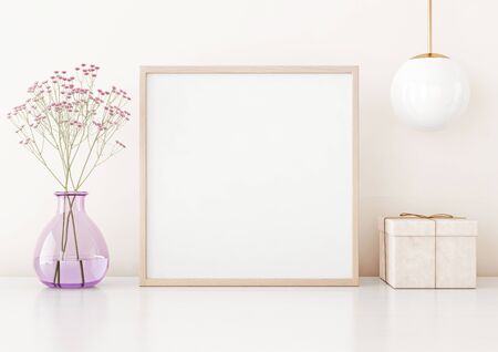 Home interior poster mock up with square frame on table, flowers in vase, lamp and box on warm white wall background. 3D rendering.の写真素材