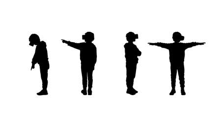 Vector silhouettes of a 8-12 years old boy in casual clothes standing in virtual reality headset.のイラスト素材