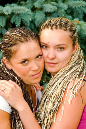 two beautiful girls with dreadlocksの写真素材