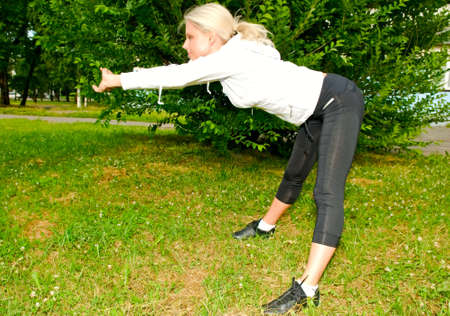 young blonde woman doing exercises