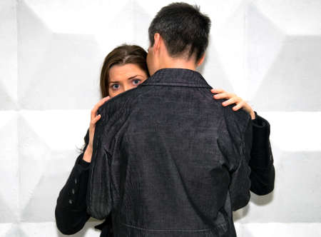 couple against the wallの写真素材