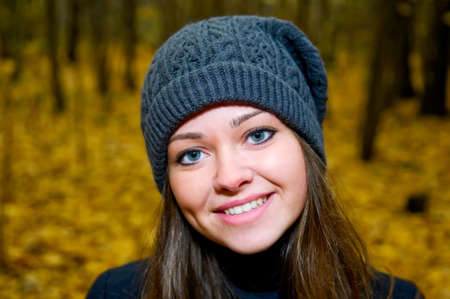 Portrait of young beautiful woman in autumn parkの写真素材