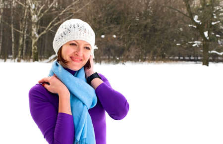 portrait of young smiling woman in white cap