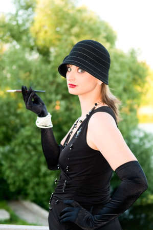 portrait of retro style attractive woman with cigarette