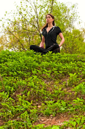 young woman in meditation poseの写真素材