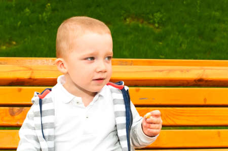 Child on benchの写真素材