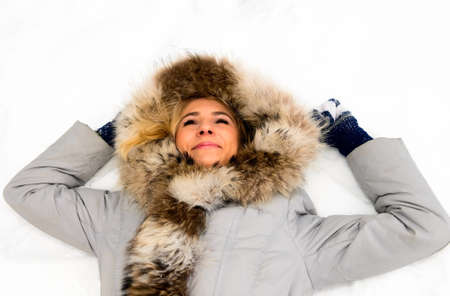 smiling girl on snowの写真素材
