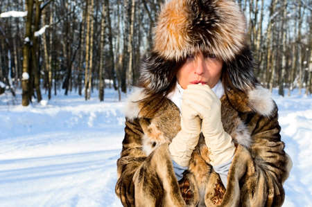 pretty caucasian girl in winter forestの写真素材