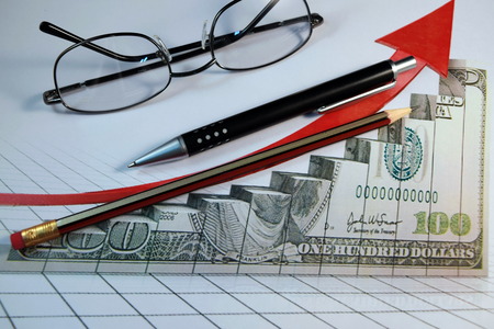 Eye Glasses, pen and pencil over the Formula with calculatorの写真素材