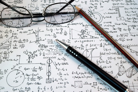 Eye Glasses, pen and pencil over the Formula with calculatorの写真素材