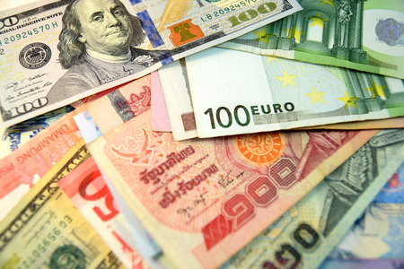 Close up of  Various currency notes and coins from different countries