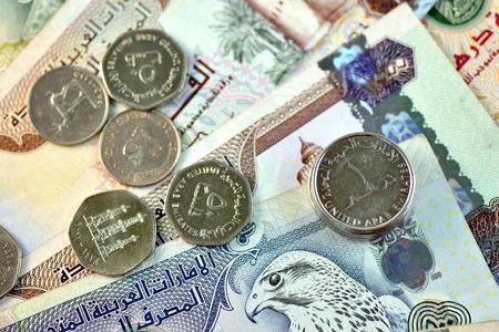 Close up different Dirhams currency note and coins, United Arab Emirates