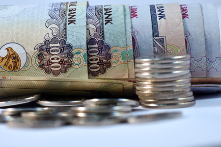 Close up different Dirhams currency note and coins, United Arab Emirates
