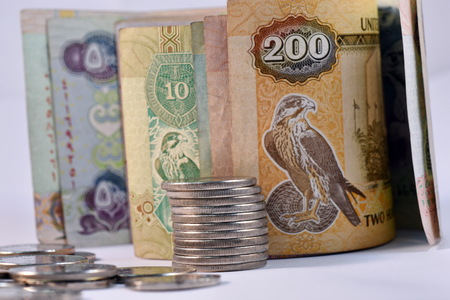 Close up different Dirhams currency note and coins, United Arab Emirates