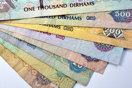 Close up different Dirhams currency note and coins, United Arab Emirates