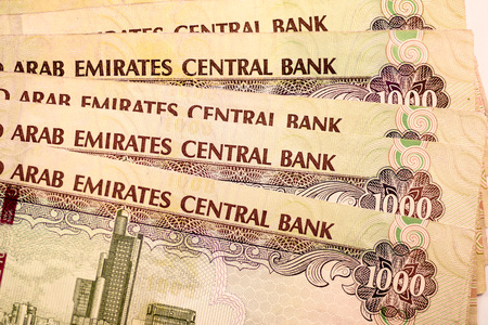 Close up Dirhams currency note and coins, AED, United Arab Emirates