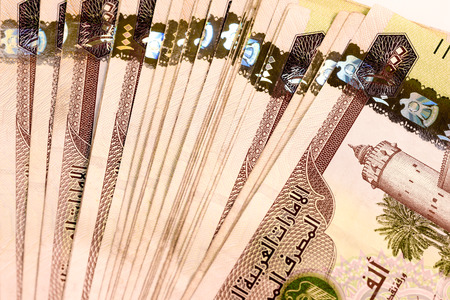 Close up Dirhams currency note and coins, AED, United Arab Emirates