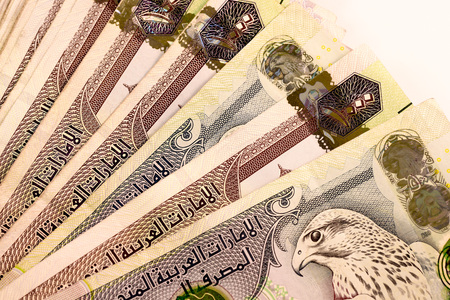 Close up Dirhams currency note and coins, AED, United Arab Emirates