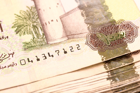 Close up Dirhams currency note and coins, AED, United Arab Emirates