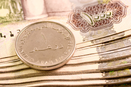 Close up Dirhams currency note and coins, AED, United Arab Emirates