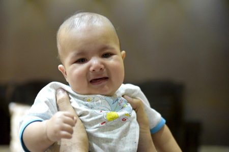 Close-up 4 months old baby at homeの写真素材