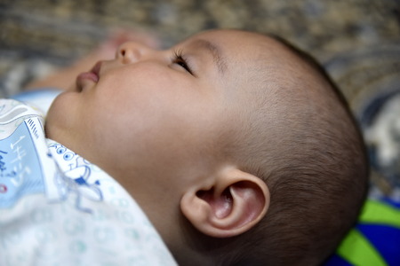 Close-up 4 months old baby at homeの写真素材