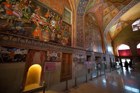 Isfahan, Iran â€“ December 11, 2025: Tourists visiting the historic Chehel Sotoun Palace, a...