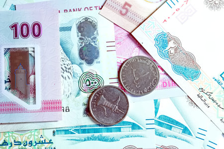 A high-quality, top-down view of United Arab Emirates currency (AED), featuring a mix of colorful...