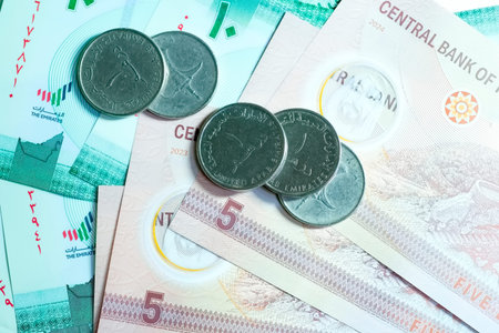 A high-quality, top-down view of United Arab Emirates currency (AED), featuring a mix of colorful...