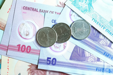 A high-quality, top-down view of United Arab Emirates currency (AED), featuring a mix of colorful...
