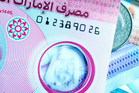 A high-quality, top-down view of United Arab Emirates currency (AED), featuring a mix of colorful...