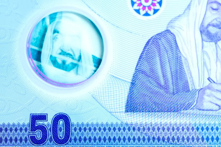 A high-quality, top-down view of United Arab Emirates currency (AED), featuring a mix of colorful...