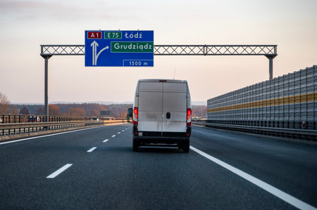Truck driving on highway in the evening. Transportation and logistics conceptの写真素材