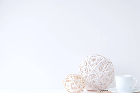 Minimal elegant composition with rattan balls and coffee cupの写真素材
