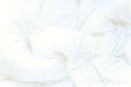 Soft white bed sheets backgroundの写真素材