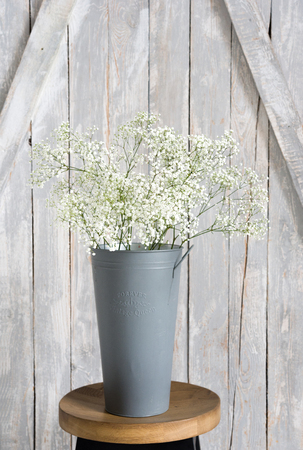 Soft home decor, small vases with baby's breath bouquet. Interior.の写真素材