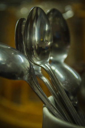 Few long tea spoons in the dryer containerの写真素材
