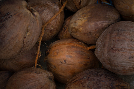 Stacked old coconuts waiting for the buyer