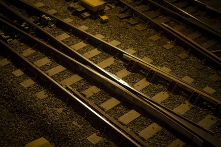 Train rail track in a sepia close-up pictureの写真素材