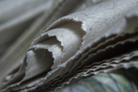 Macro shots folded a newspaper closeup pictureの写真素材